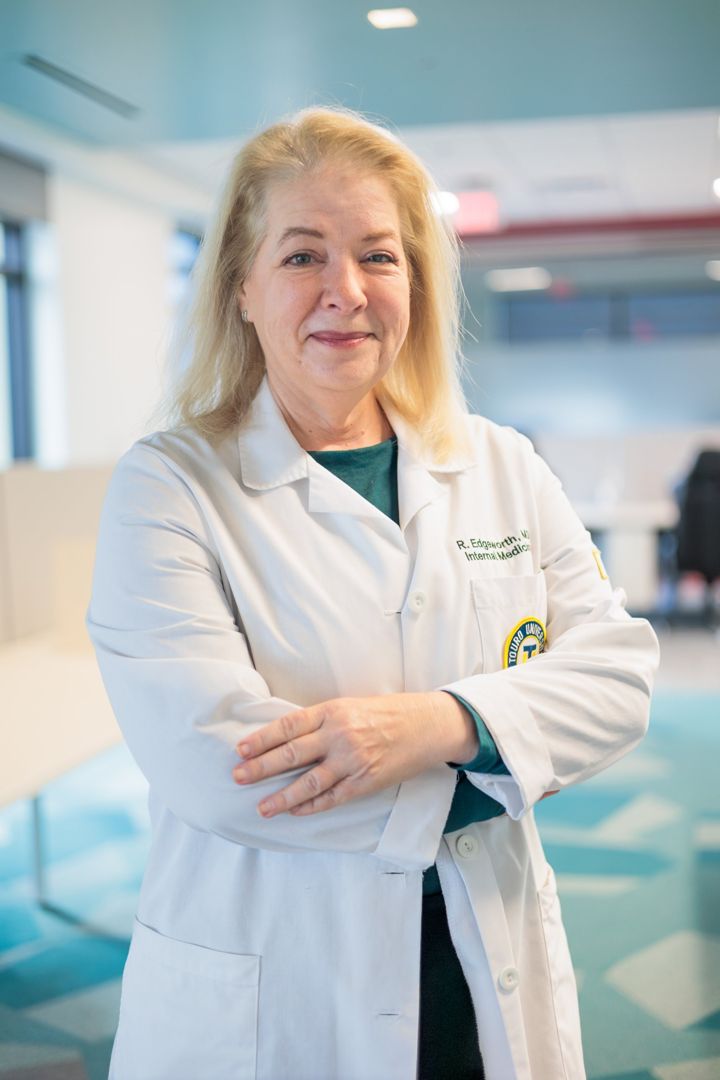 Dr. Rebecca Edgeworth in her white coat